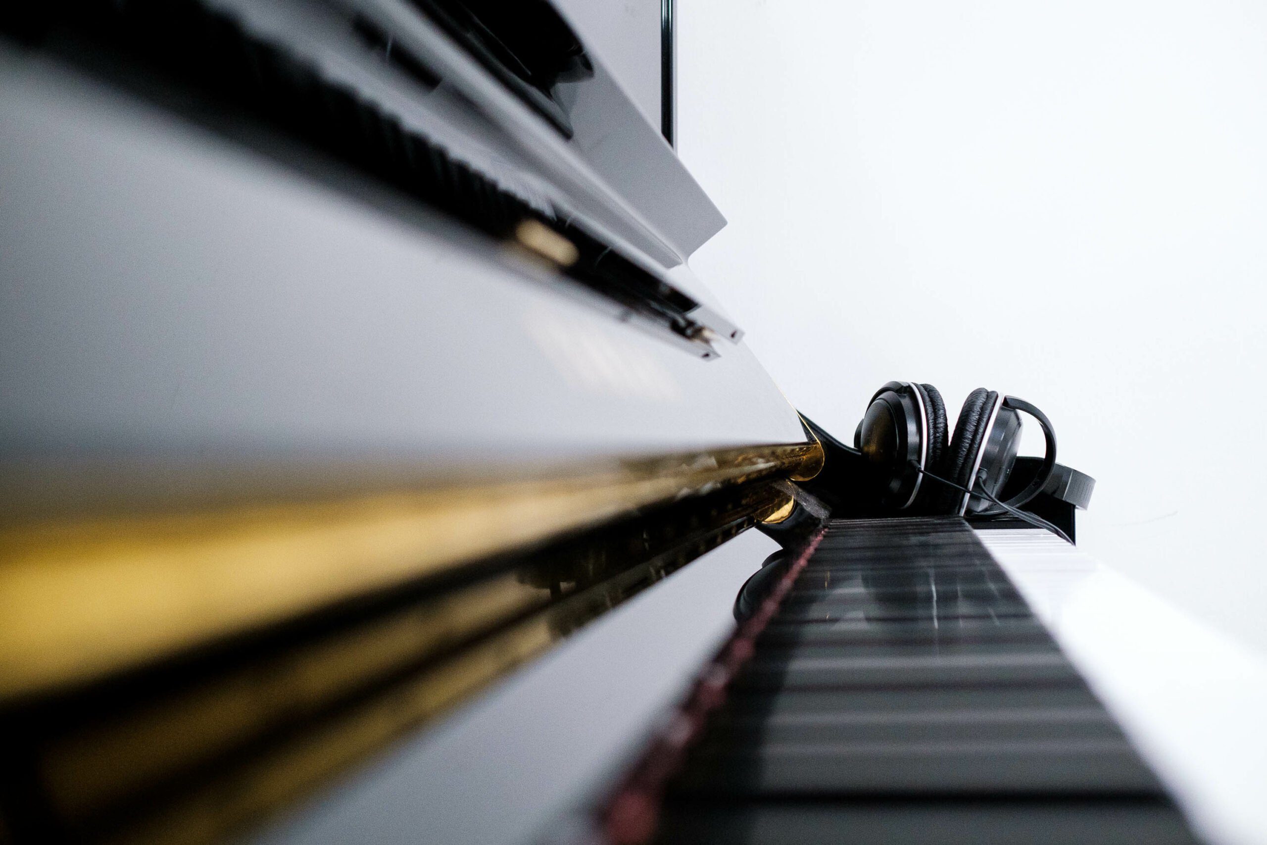 Acoustic Piano with headphones on keyboard